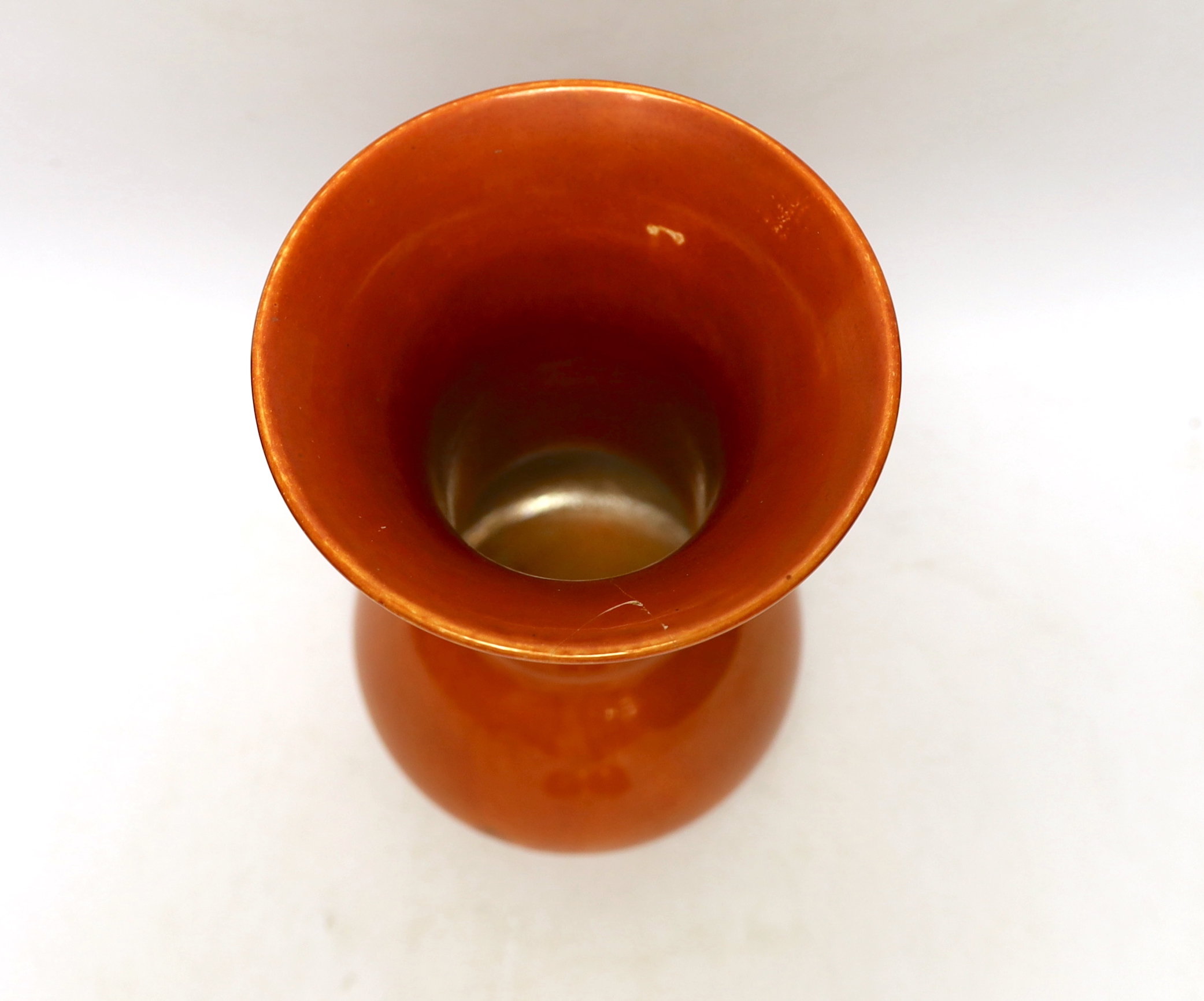 A Ruskin orange glazed vase (a.f) and three similar small bowls by Ruskin and Doulton, vase 23.5cm